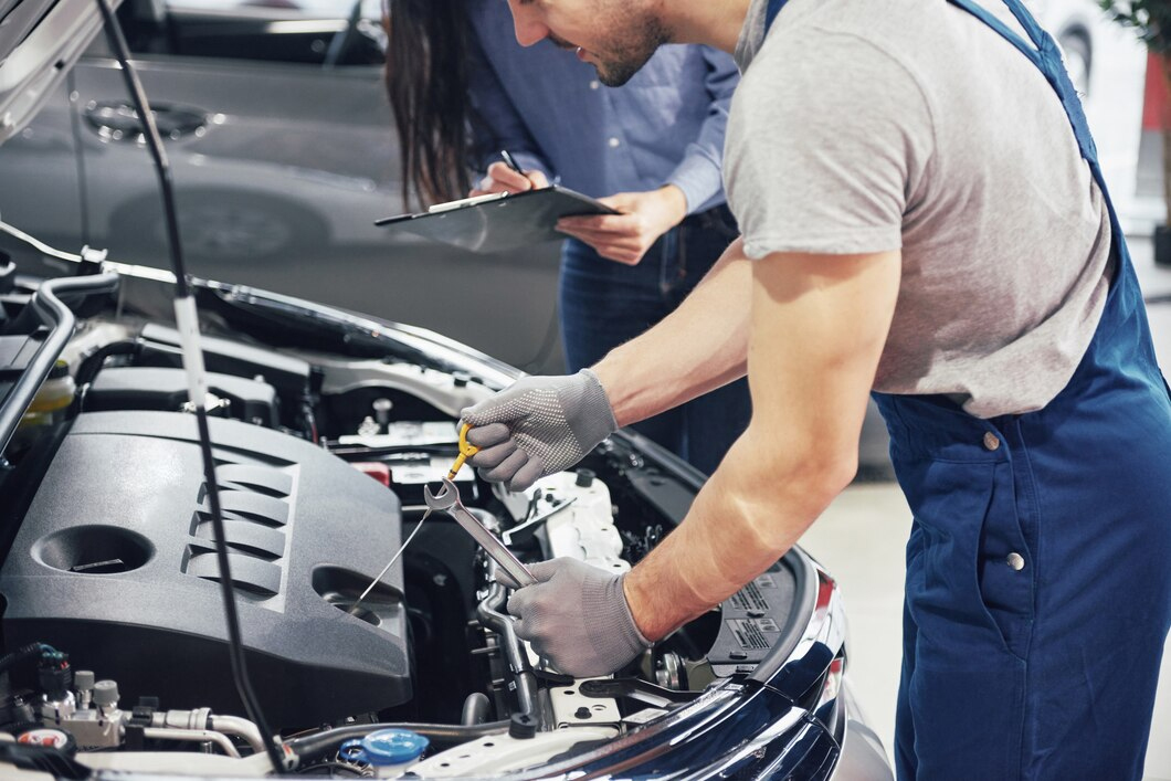 Technician performing professional car services Dubai at Premium Car Hub workshop