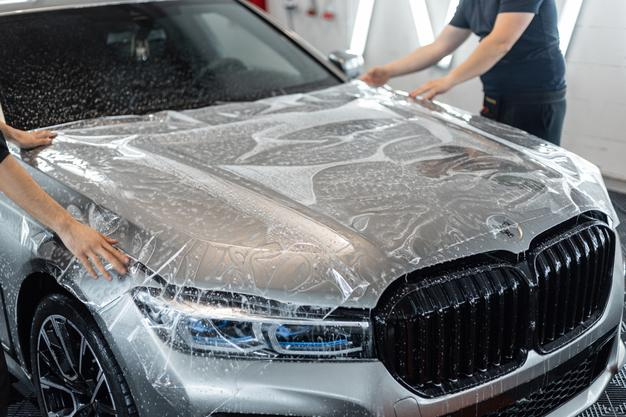 Luxury car receiving PPF installation at Premium Car Hub Dubai